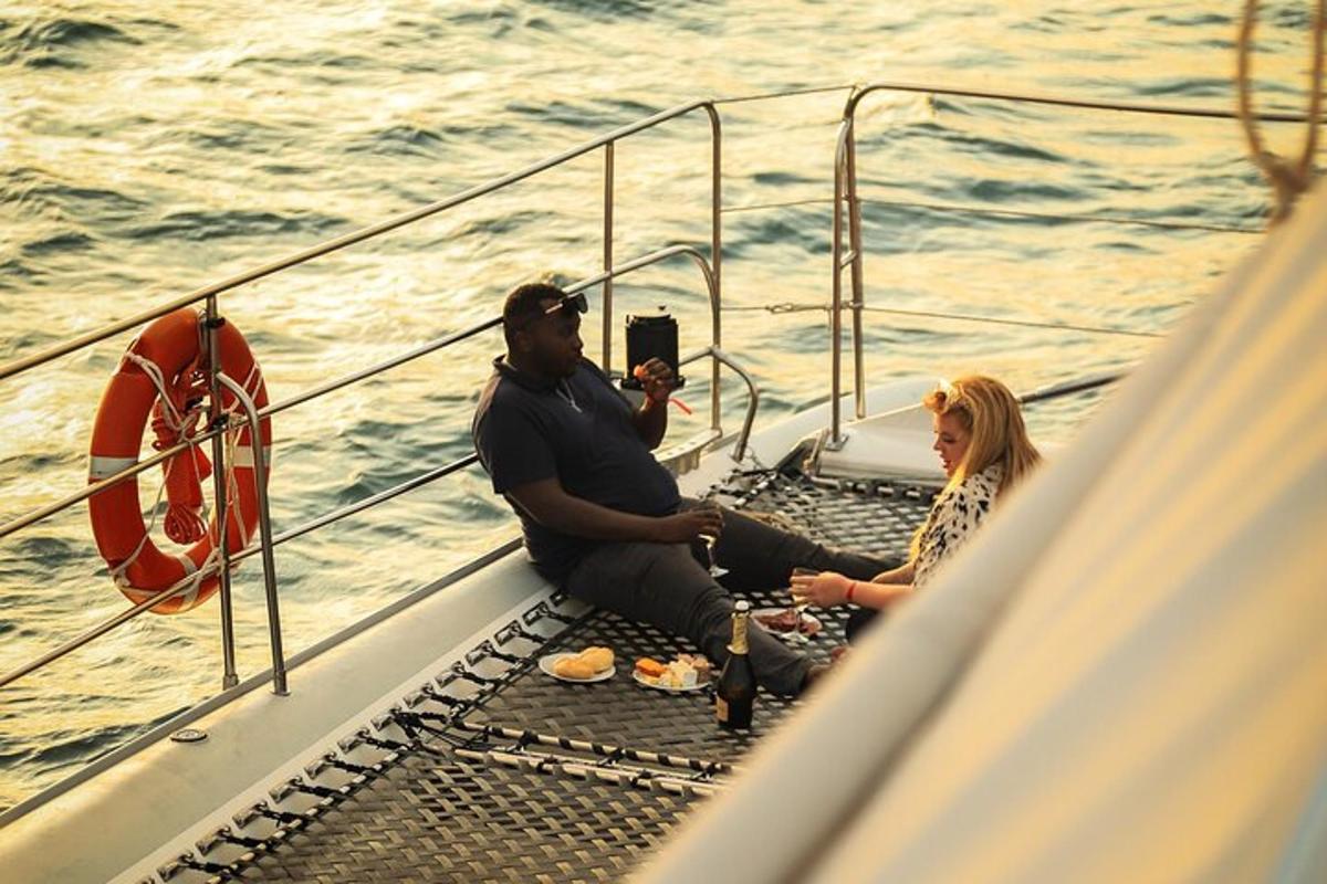a group of people sitting on the front of a boat