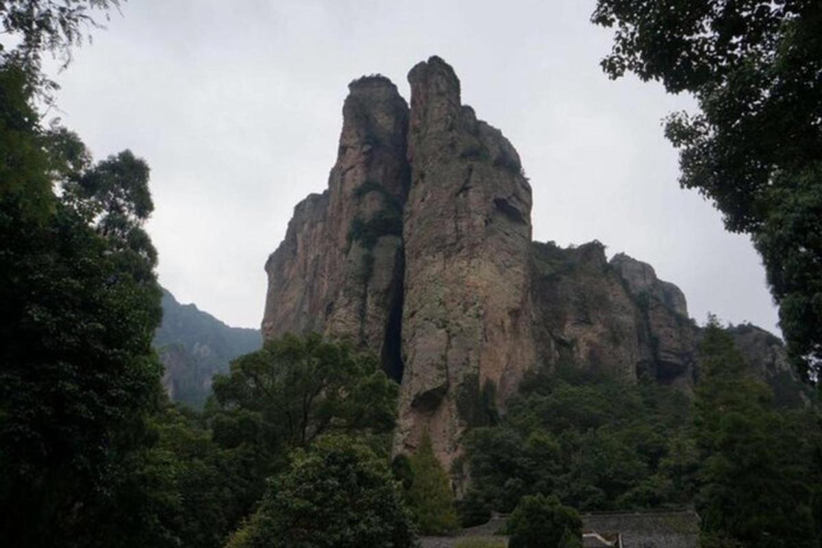 a large rock formation in the middle of a mountain