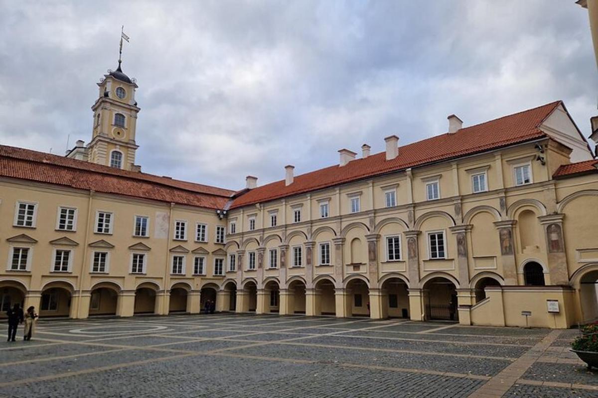 a large building with a clock tower in the background