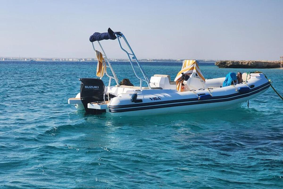 a blue and white boat in the water