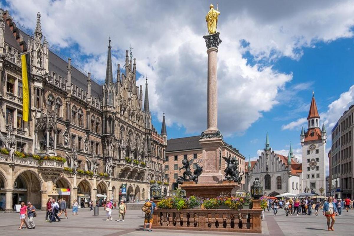 a city square with a statue in front of a building