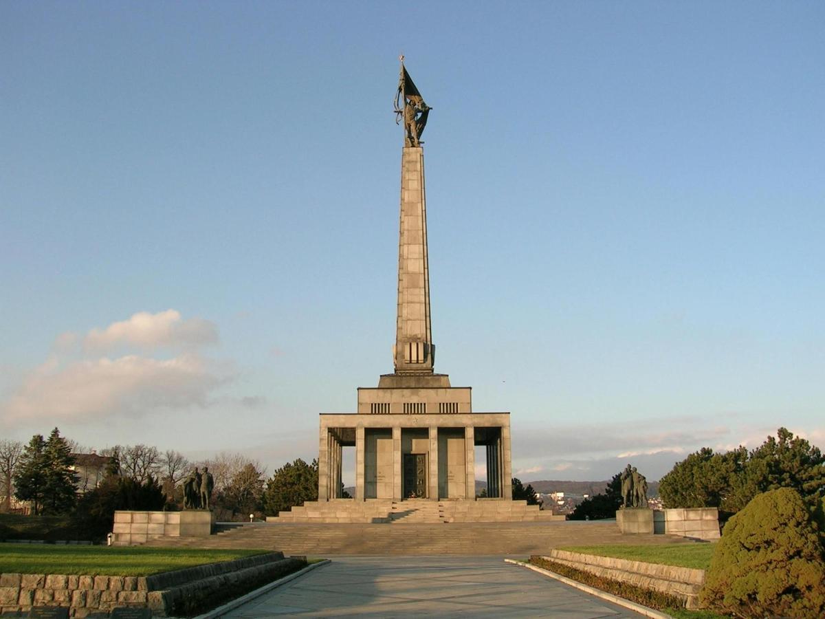 a monument with a statue on top of it