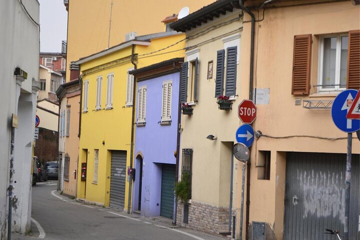 a street with brightly colored buildings with a stop sign