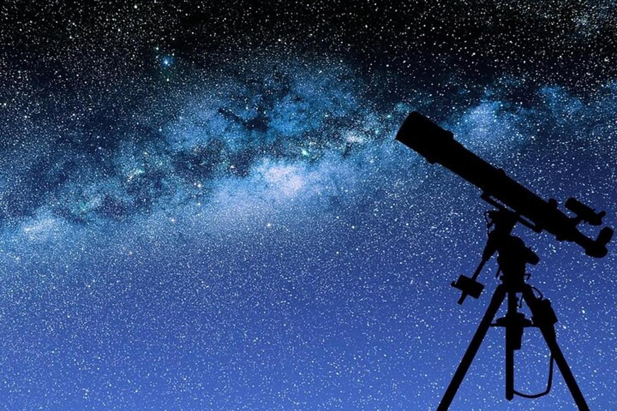 a telescope in front of the milky way
