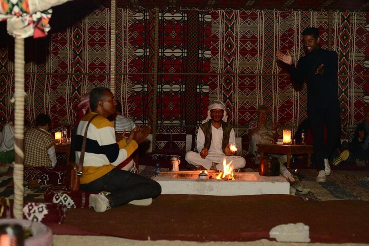 a group of men sitting in a room with candles