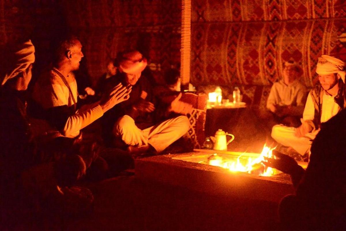 a group of people sitting around a fire in a room