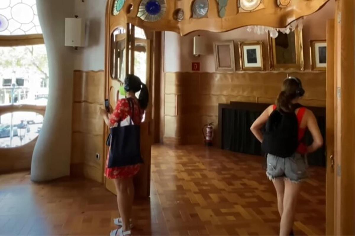 two women are standing in a room