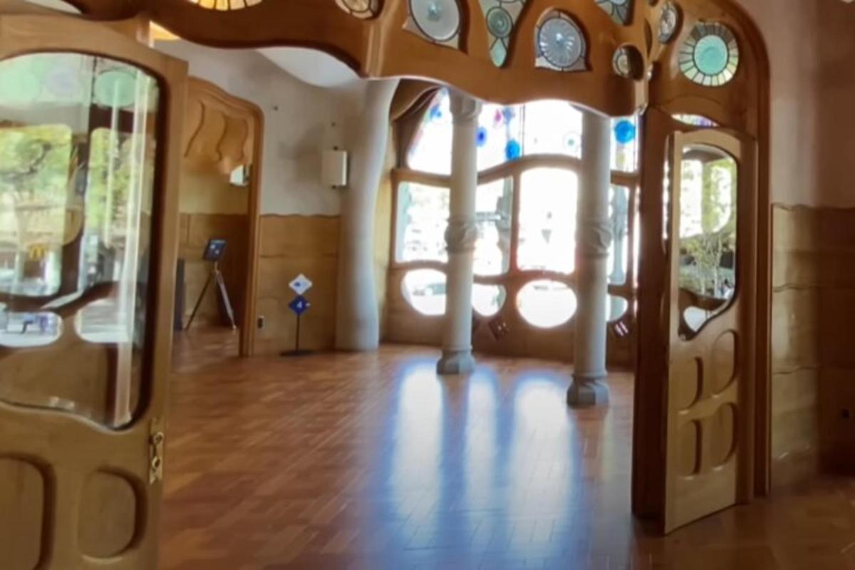 a room with a wooden floor and a glass door