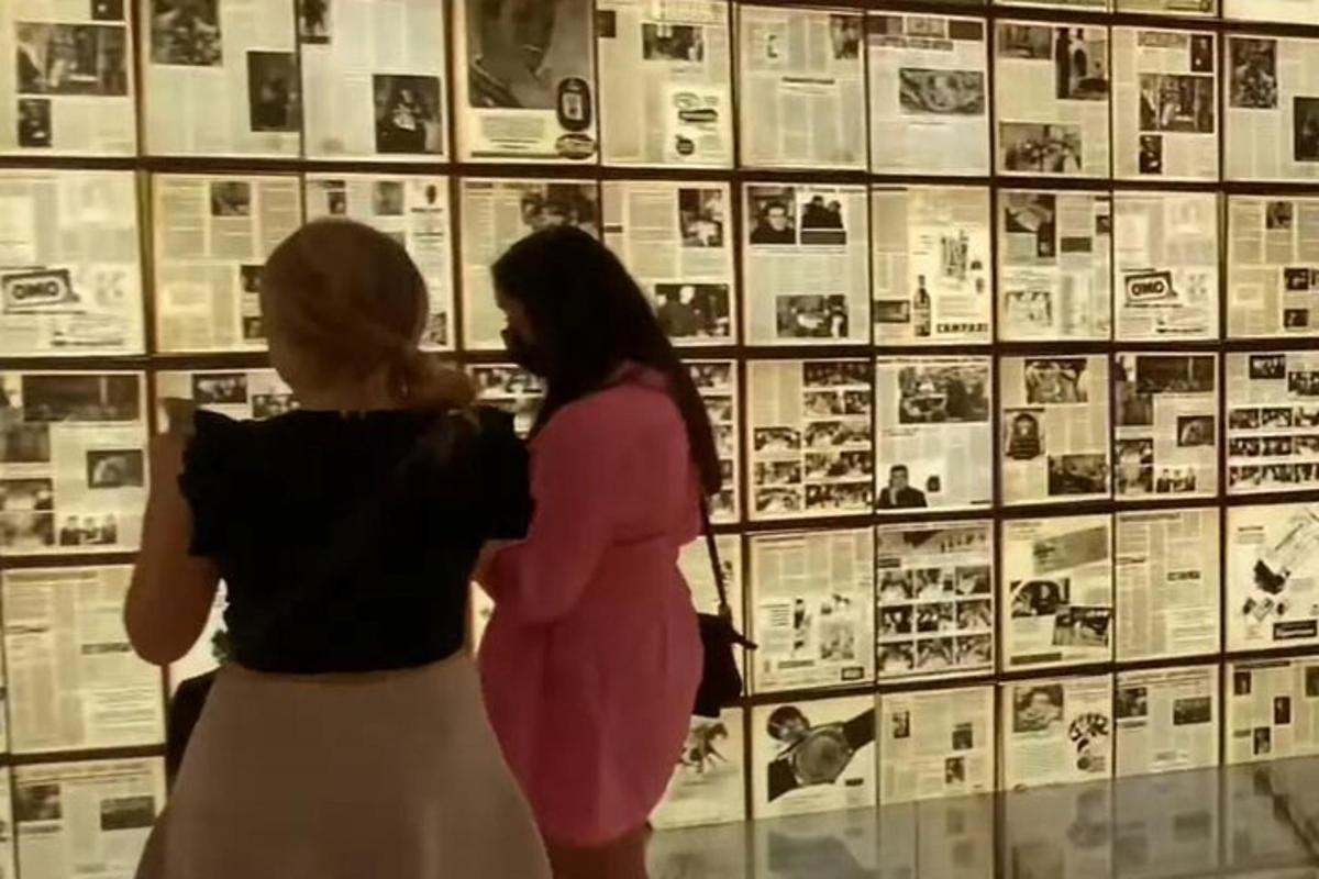 two women looking at a display in a museum