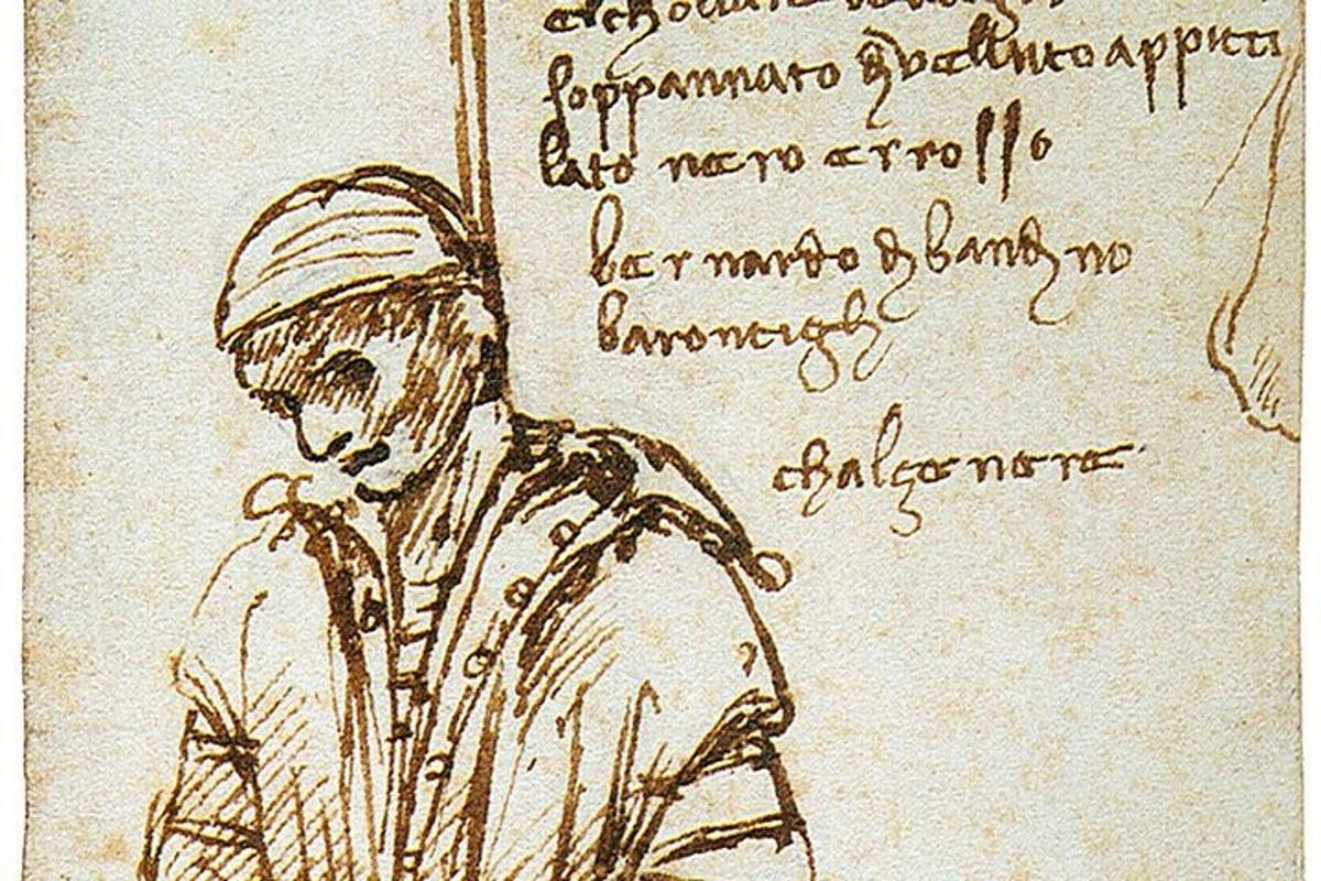 un disegno di un uomo con la scrittura a mano su un foglio di carta