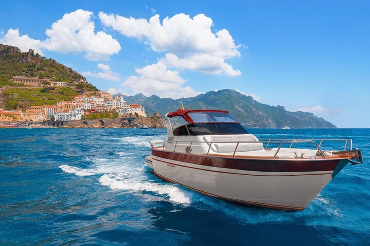 a boat in the water with a town in the background