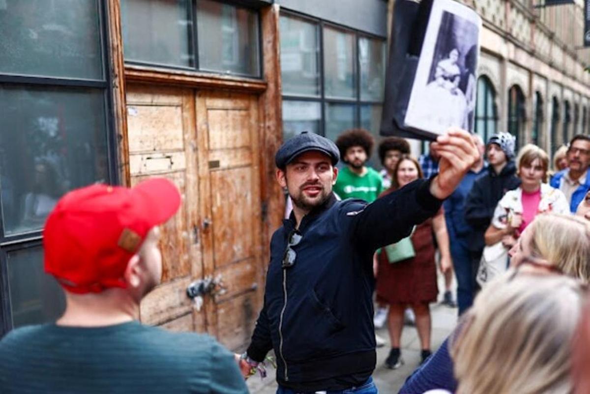a man taking a picture of a crowd of people