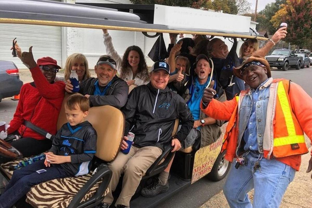 a group of people riding in the back of a truck