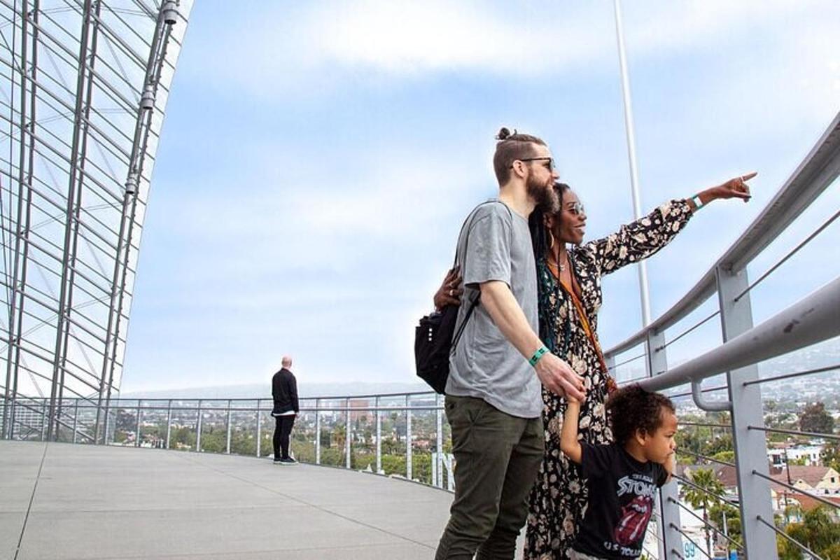 a man and a woman standing on a bridge