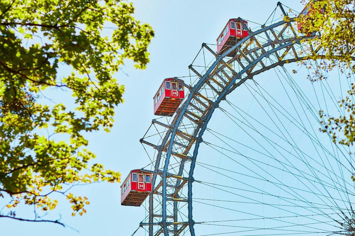 a ferris wheel with a red train on it
