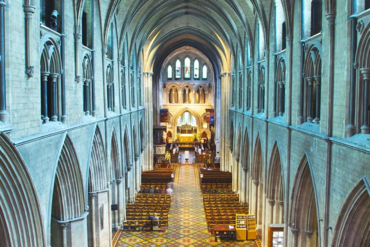 a view of a large cathedral with stairs in it