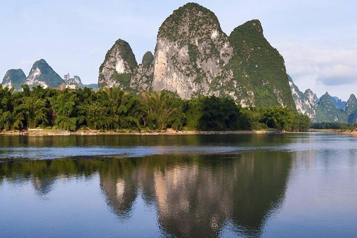 a large body of water with mountains in the background