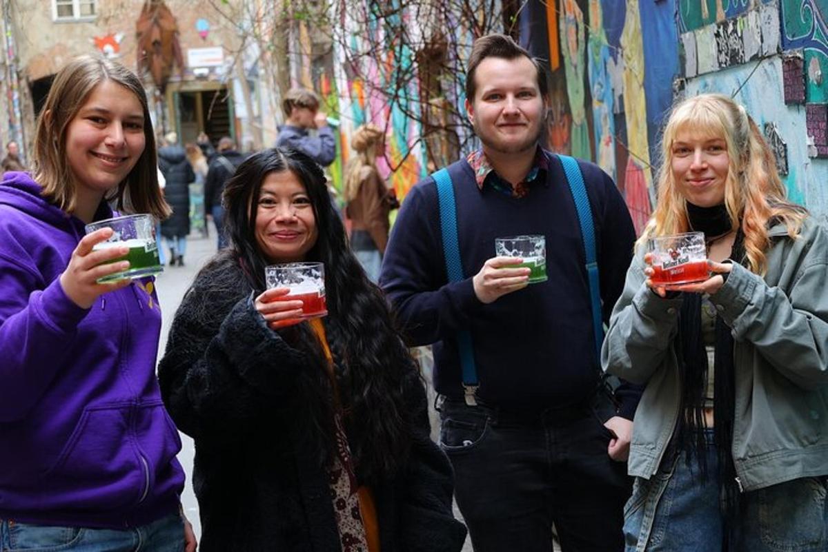 a group of people holding up glasses of drink