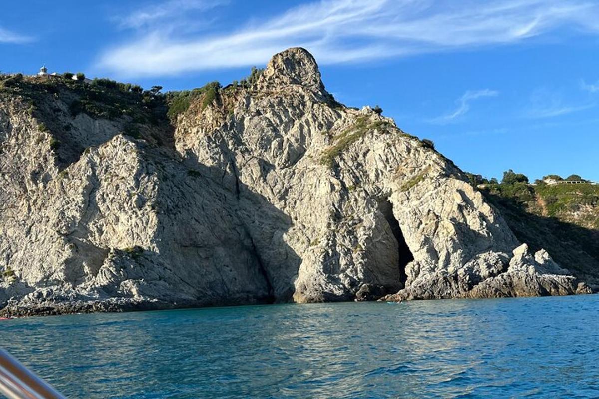a rock formation in the middle of the water