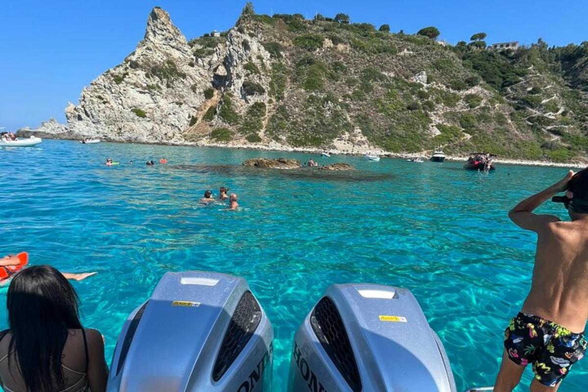 a group of people in the water on a boat