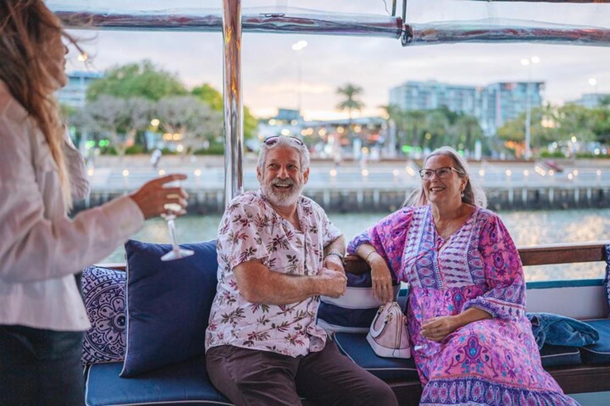 an older man and woman sitting on a boat