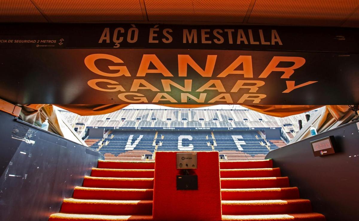 a sign for a stadium with stairs in front