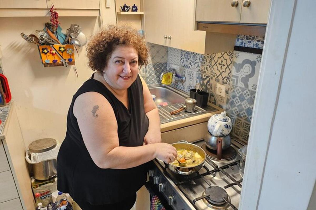 a woman in a kitchen preparing food in a bowl