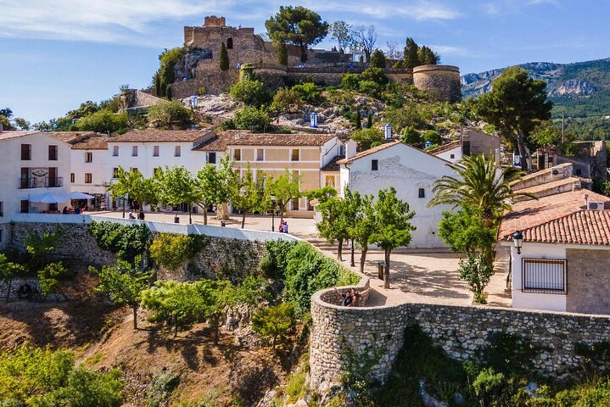 a village with a castle on a hill