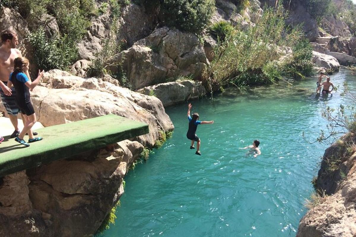 a group of people swimming in a river
