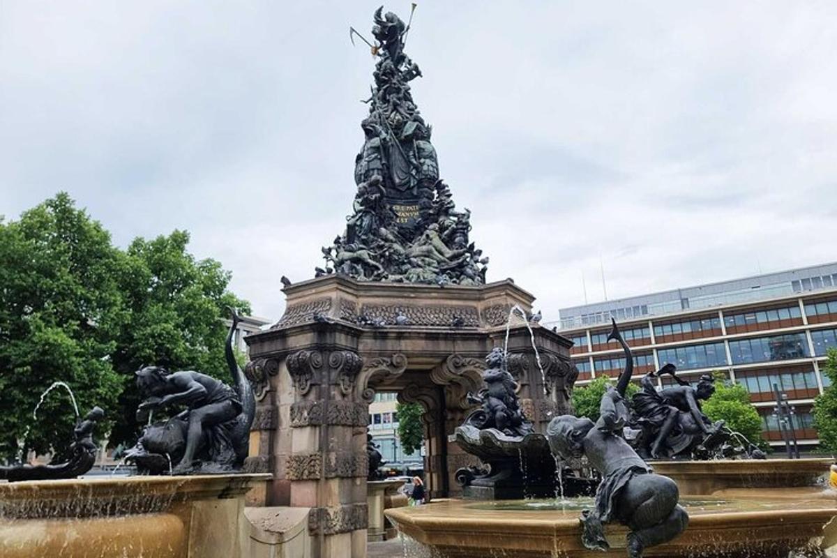a fountain with a statue in the middle of a building