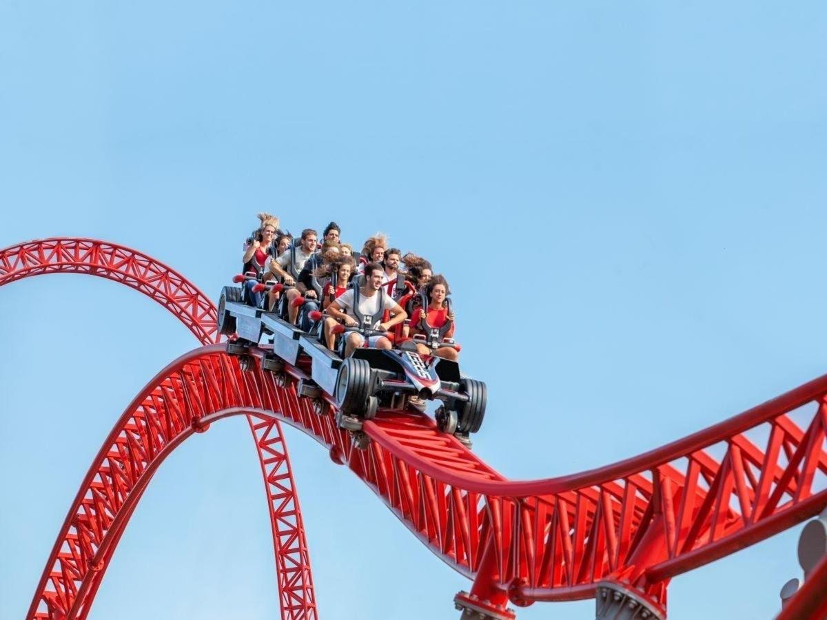 a group of people riding on a roller coaster