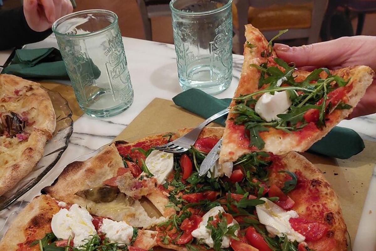 two slices of pizza sitting on top of a table