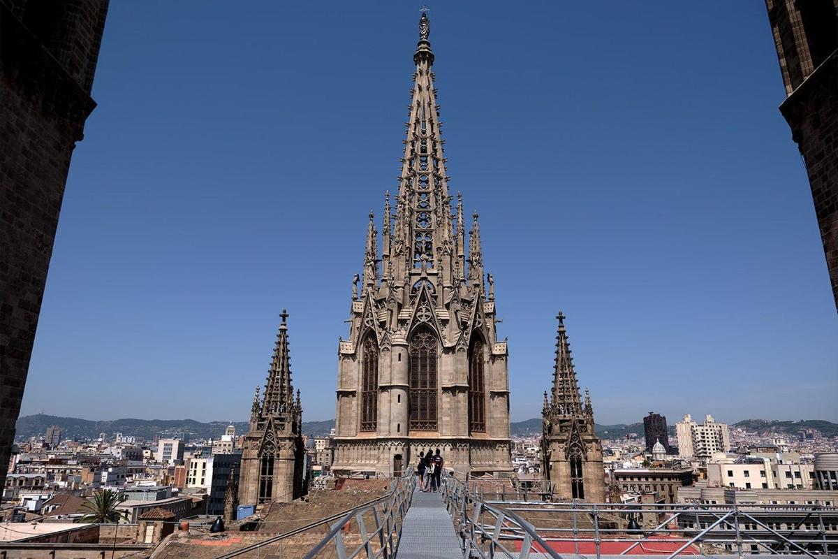 a large building with a tall tower in a city