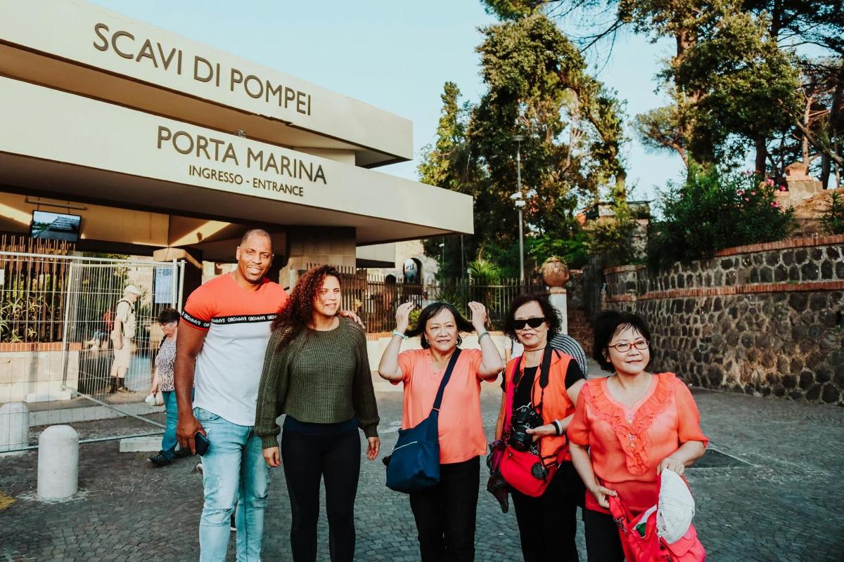 a group of people standing in front of a store