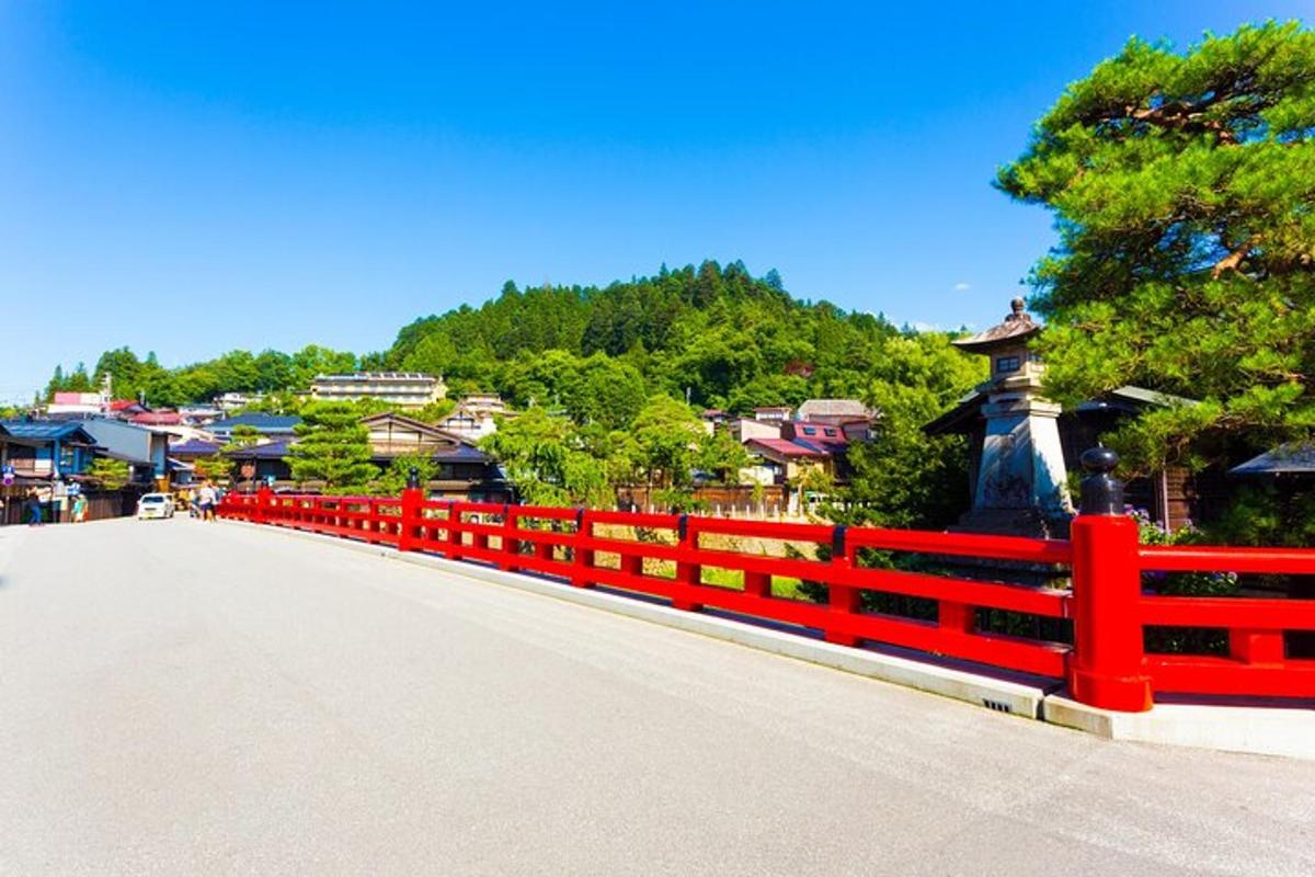 a red fence on the side of a road