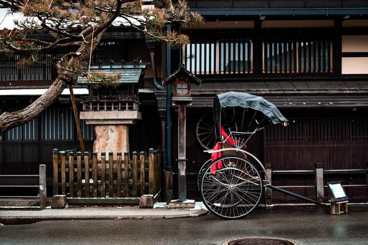 a bike with an umbrella parked next to a building