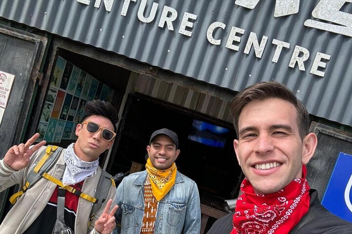 a group of men standing outside of a store