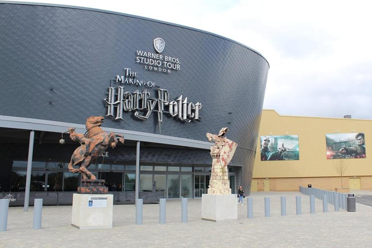 a large building with a statue in front of it