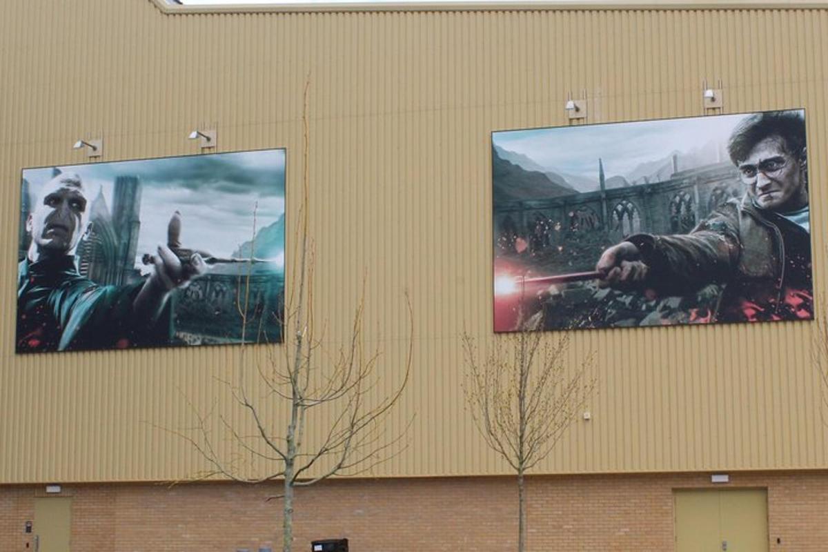 two posters of a movie on the side of a building