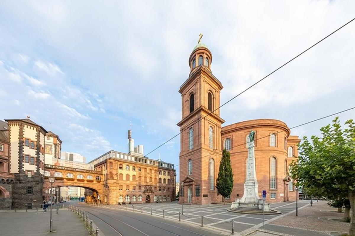 a building with a clock tower in the middle of a street
