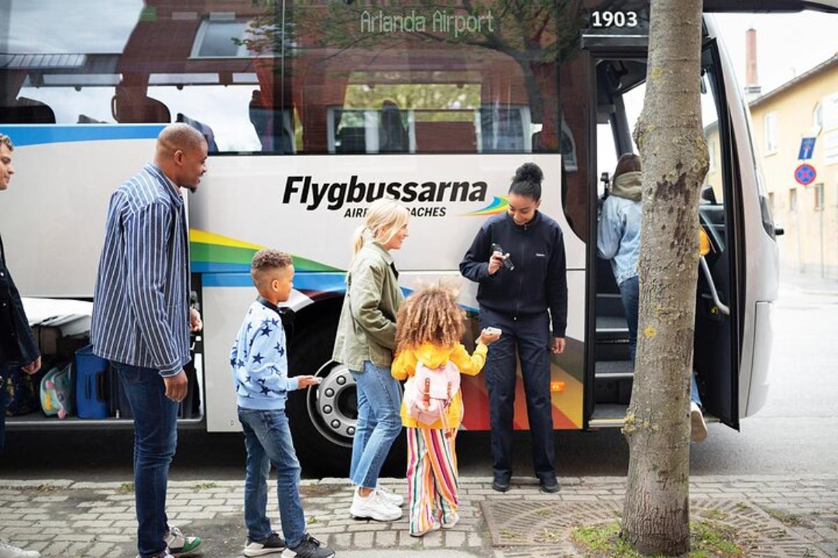 a group of people standing in front of a bus