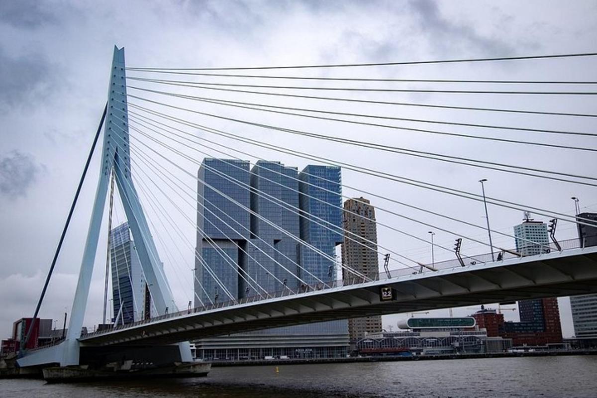 a bridge over a river with buildings in the background