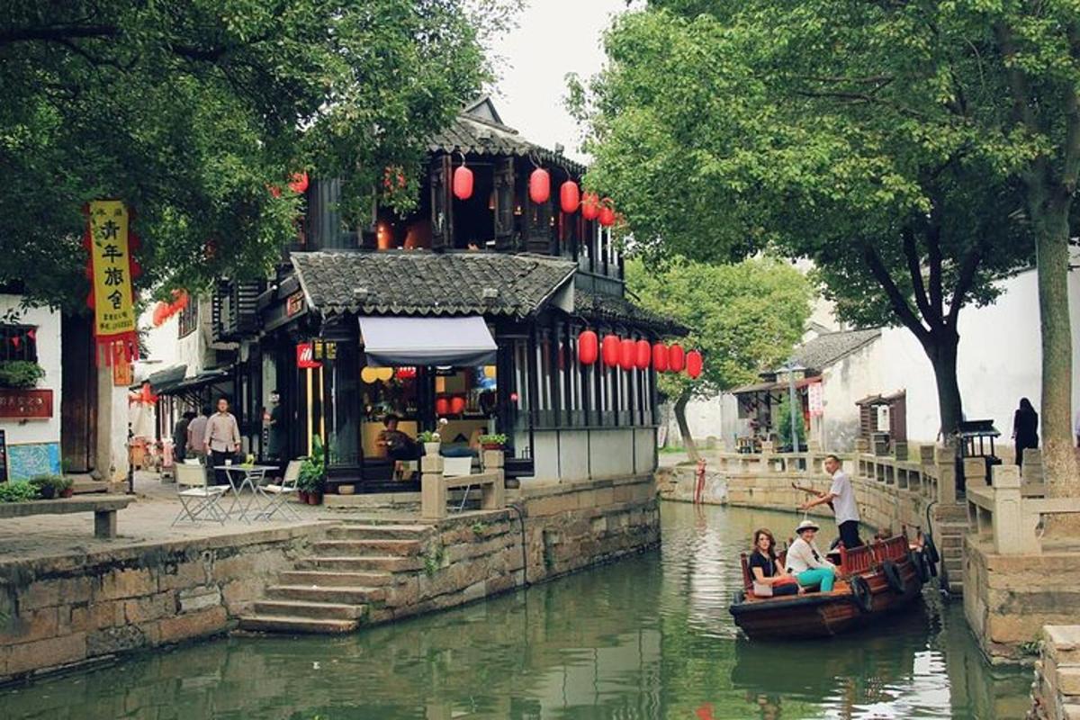 a group of people in a boat on a river