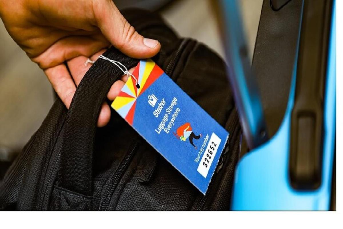 a person holding a tag on a bag