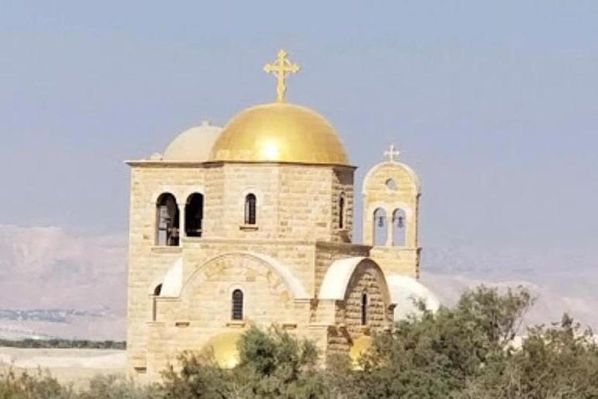 a church with a gold dome on top