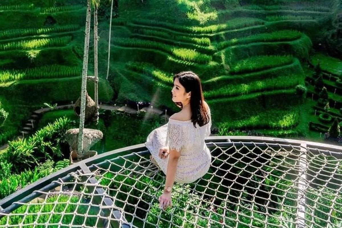a woman sitting on a net in front of a maze