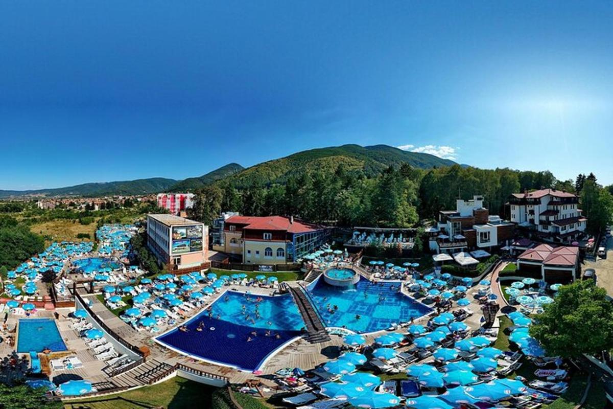 an aerial view of a resort with a swimming pool