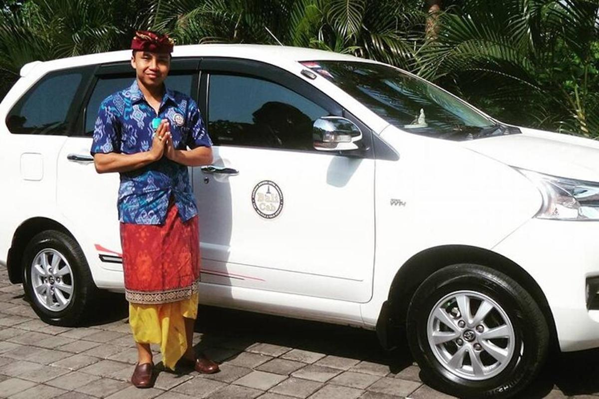 a man standing in front of a white car