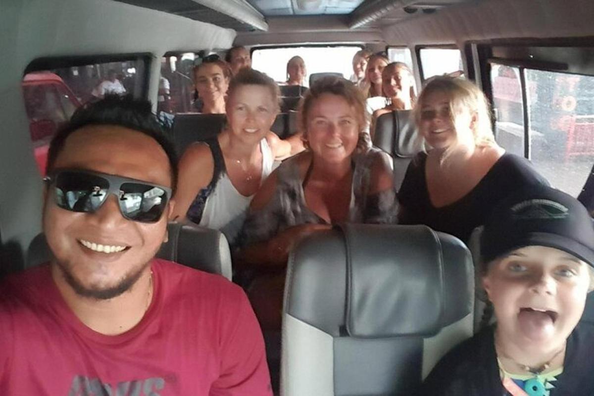 a group of people sitting in the back of a bus