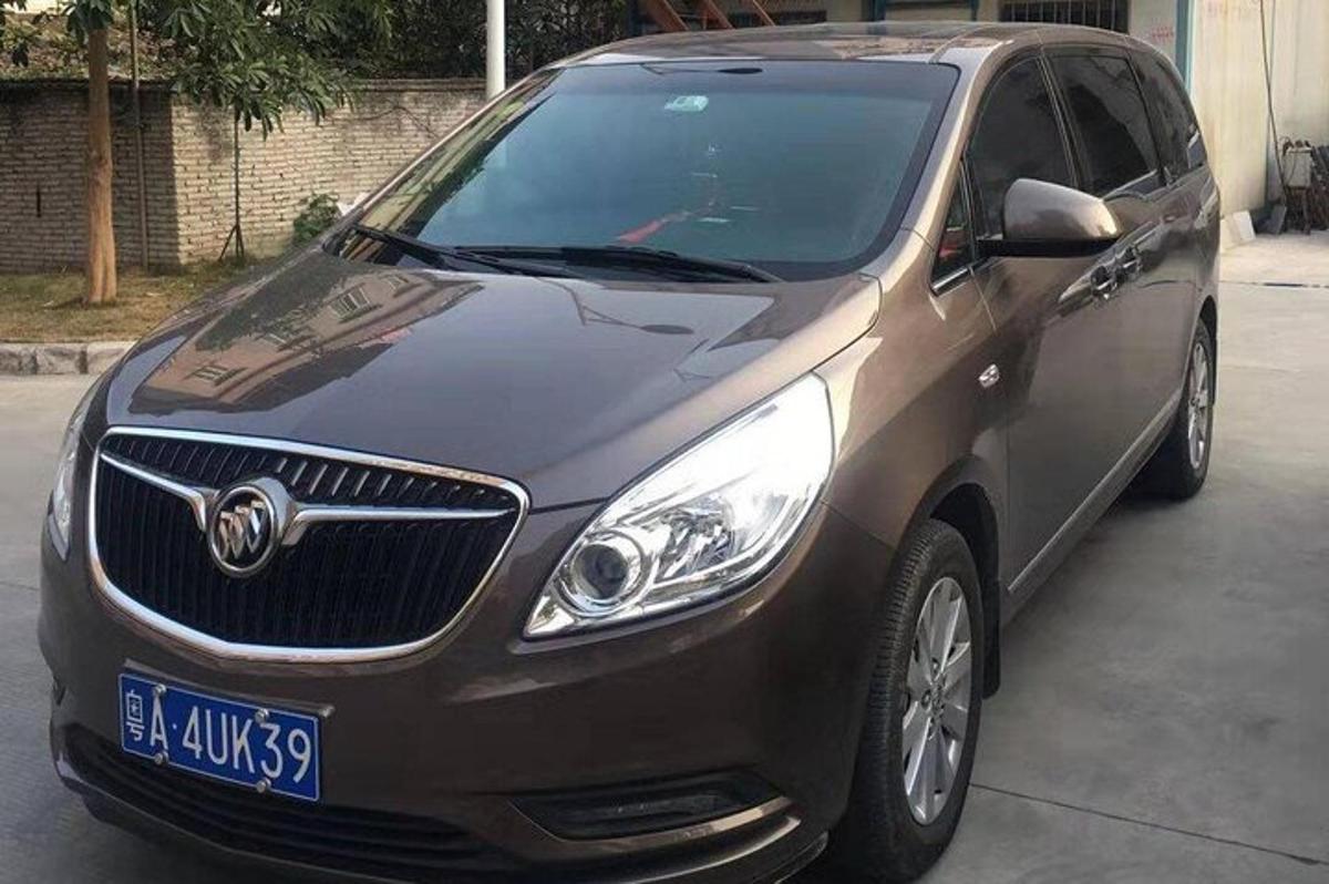a brown suv parked in a parking lot